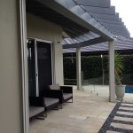 Covered outdoor seating area with tiled flooring