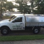 Work ute with signage for Asto’s Painting & Decorating parked near the waterfront.